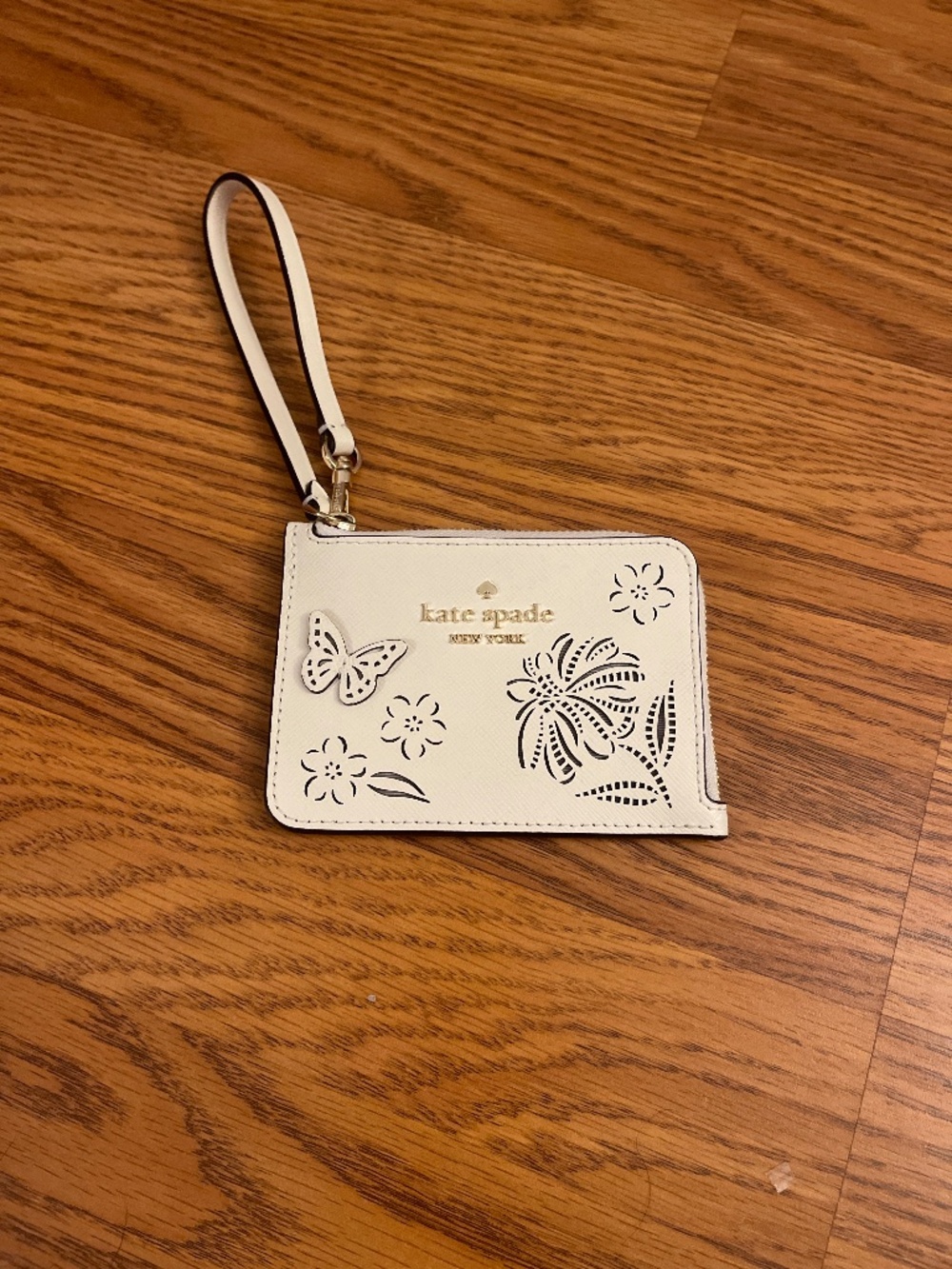 Kate Spade Lucy Perforated wristlet Floral Butterfly